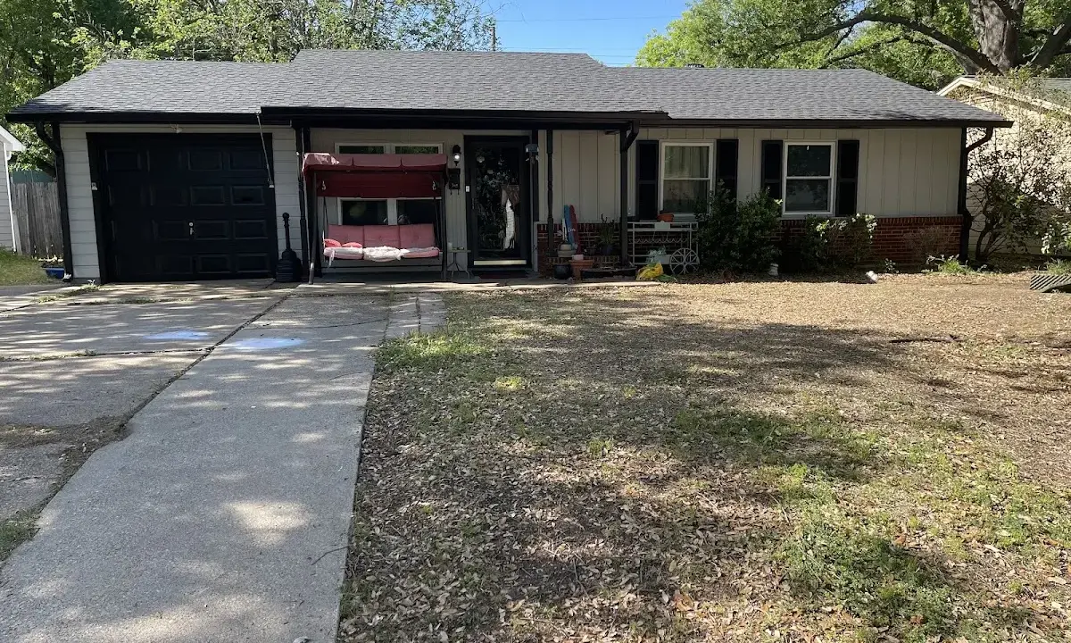 Metal Roof Installation crew at work on a residential roof in Yulee